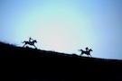 Boys Riding Horses at Dawn